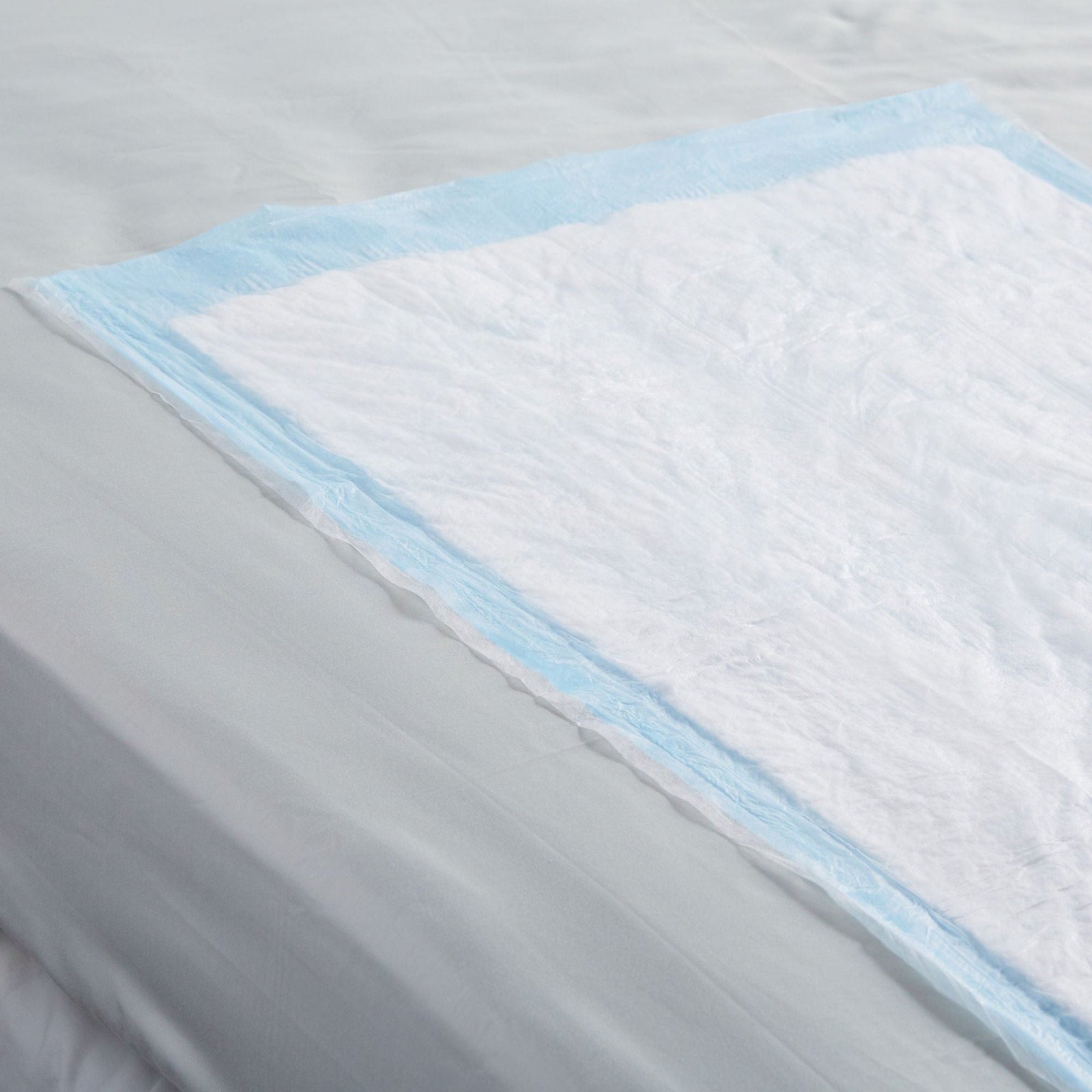 Underpad Simplicity™ Extra 23 X 36 Inch Disposable Fluff Moderate Absorbency 605058 - 1093 605058 – 1093 - Image 4